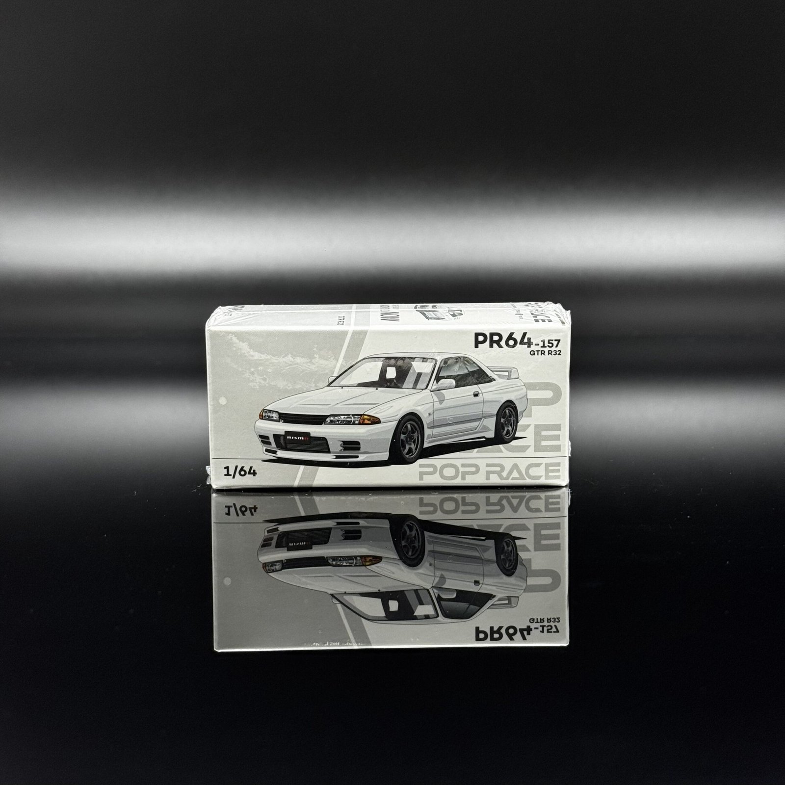 IMG_6572 POP Race 1:64 1989 Nissan Skyline GT-R (R32) Coupe White Diecast Model Car - Image 1