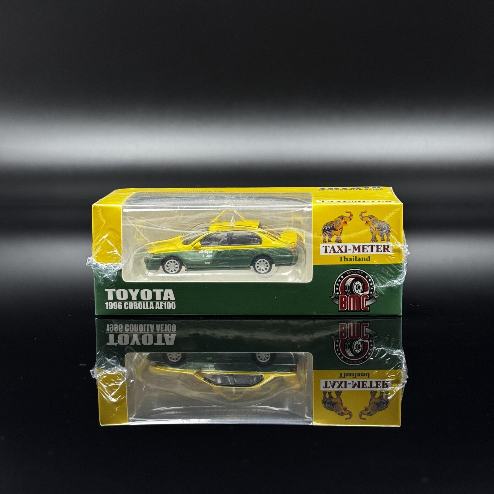 IMG_6575 1996 Toyota Corolla AE100 1:64 Diecast Model Car by BMC – Yellow/Green Taxi Livery - الصورة 1